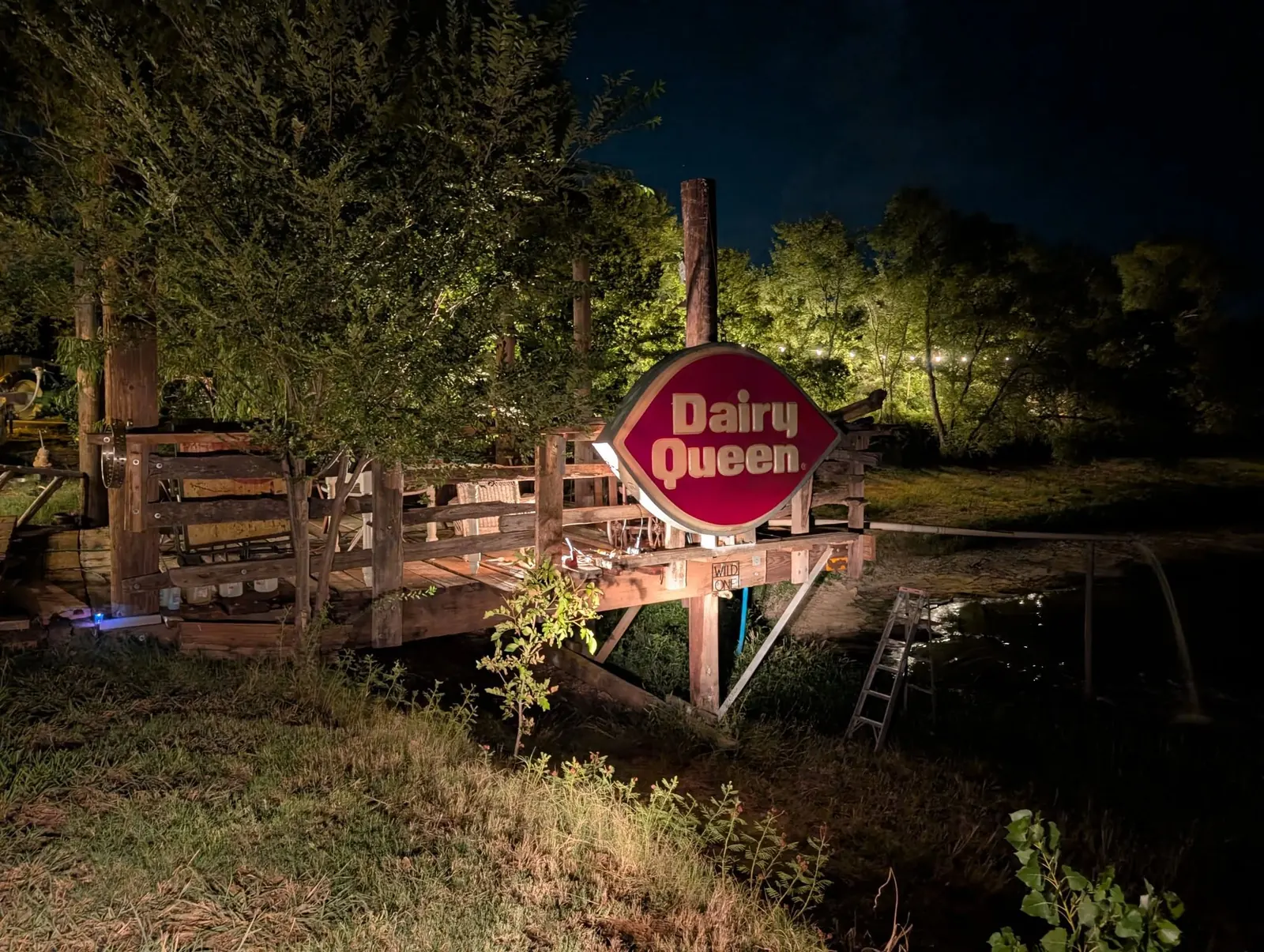 Vintage Dairy Queen sign at the Muscle Car Ranch riverfront at night