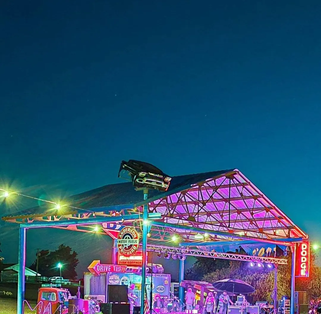 Live band performing under colorful lights on the Dodge stage at TwisterFest