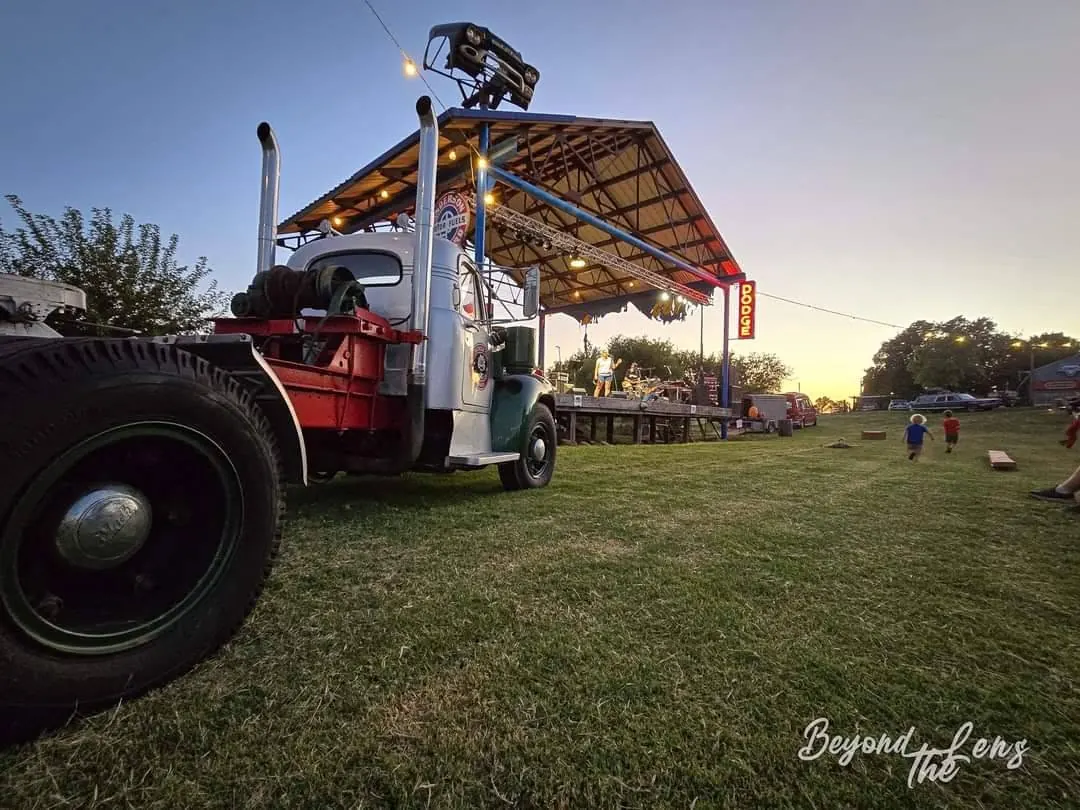 Classic truck beside a live music stage at TwisterFest at Muscle Car Ranch in Chickasha Oklahoma