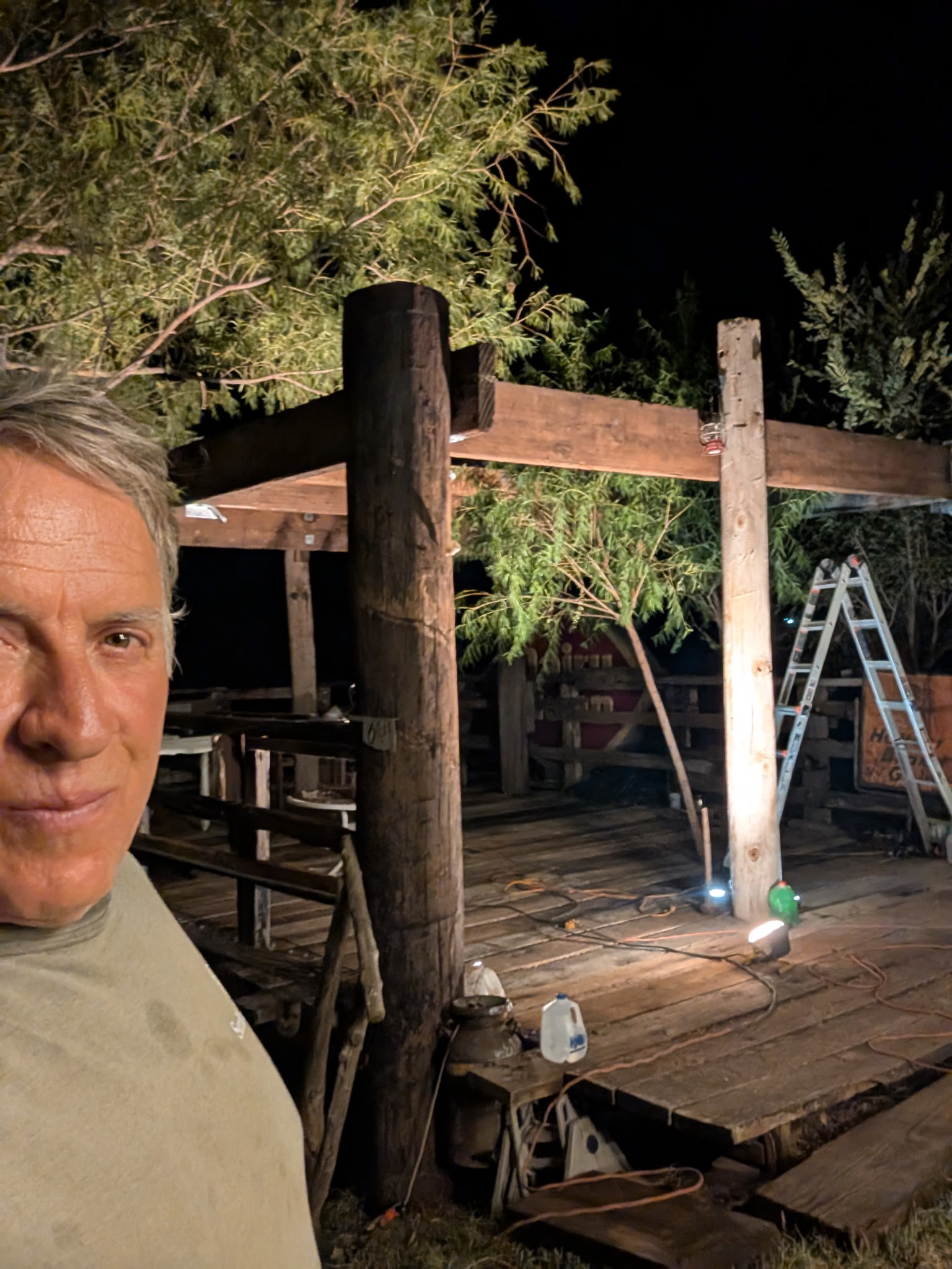 Curtis Hart beside the massive wood timber frame of the Heavy Chevy Stage at Muscle Car Ranch