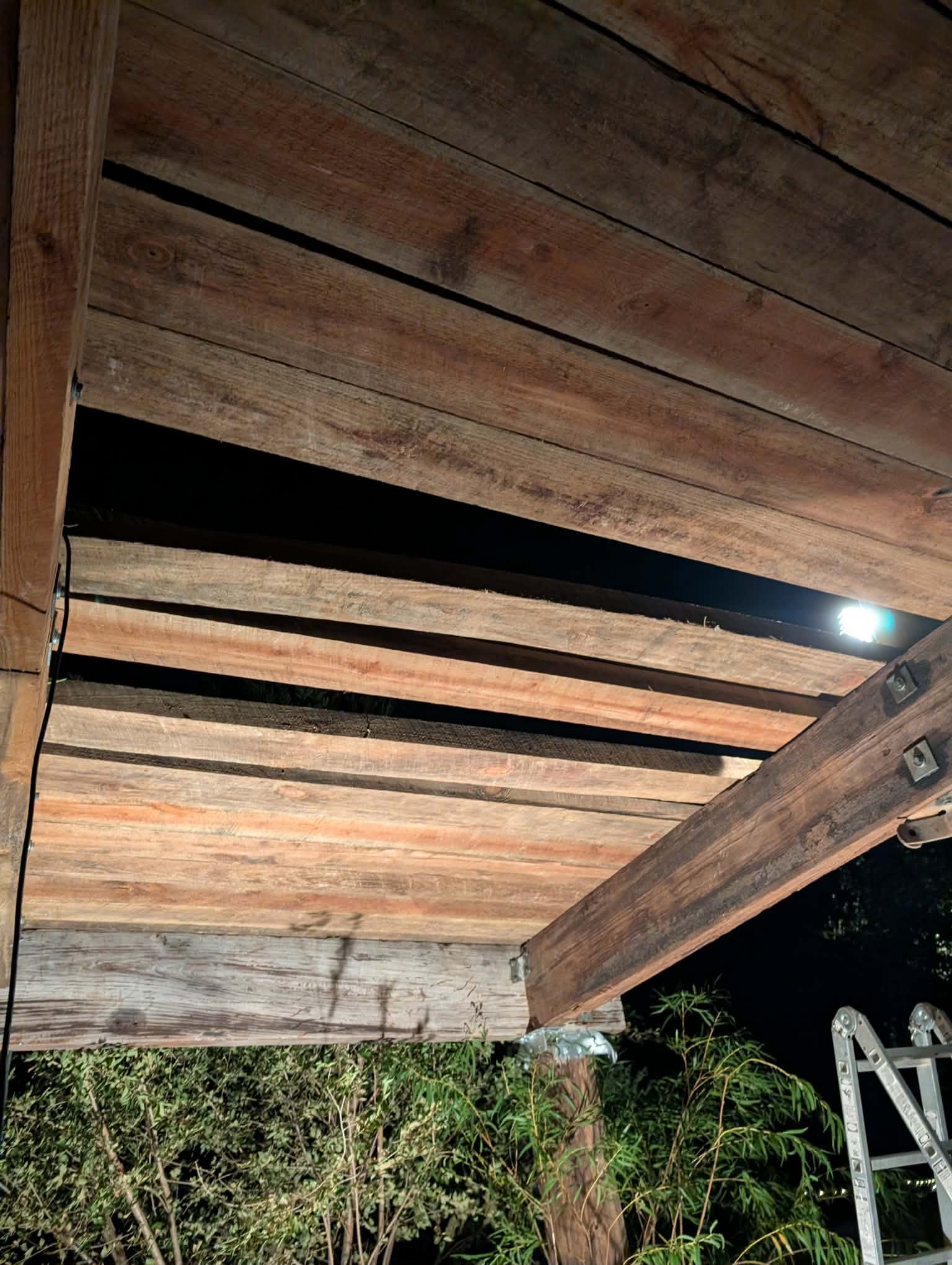 View from below of the wooden decking and heavy beams of the new Heavy Chevy stage structure at Muscle Car Ranch