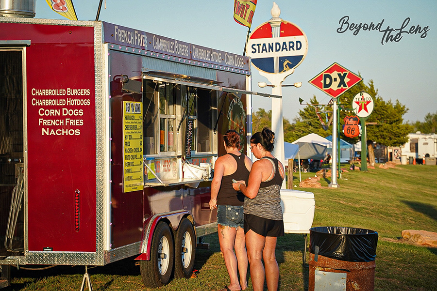 TwisterFest food vendors and vintage signage at Muscle Car Ranch